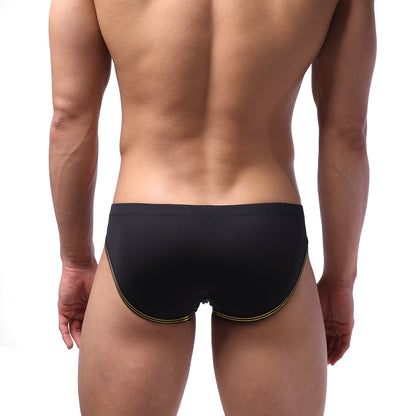 Black swim trunks with gold trim along leg openings from MetroMaleWear highcut hip brief gold 5103-30 collection