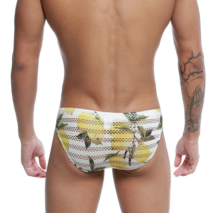 White mesh swim trunks with vibrant yellow lemon and green leaf pattern from metromalewear mango bikini 5103-36