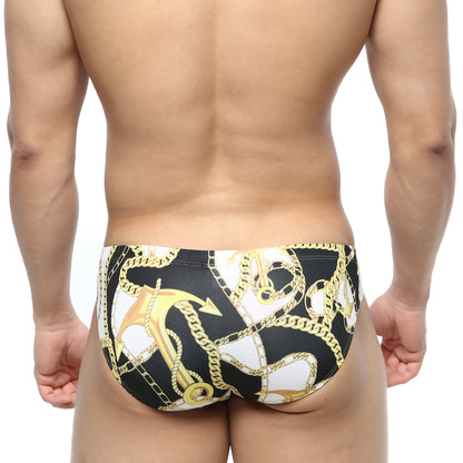 MetroMaleWear Lujo bikini black swim trunks with bold gold and white anchor and chain pattern for men