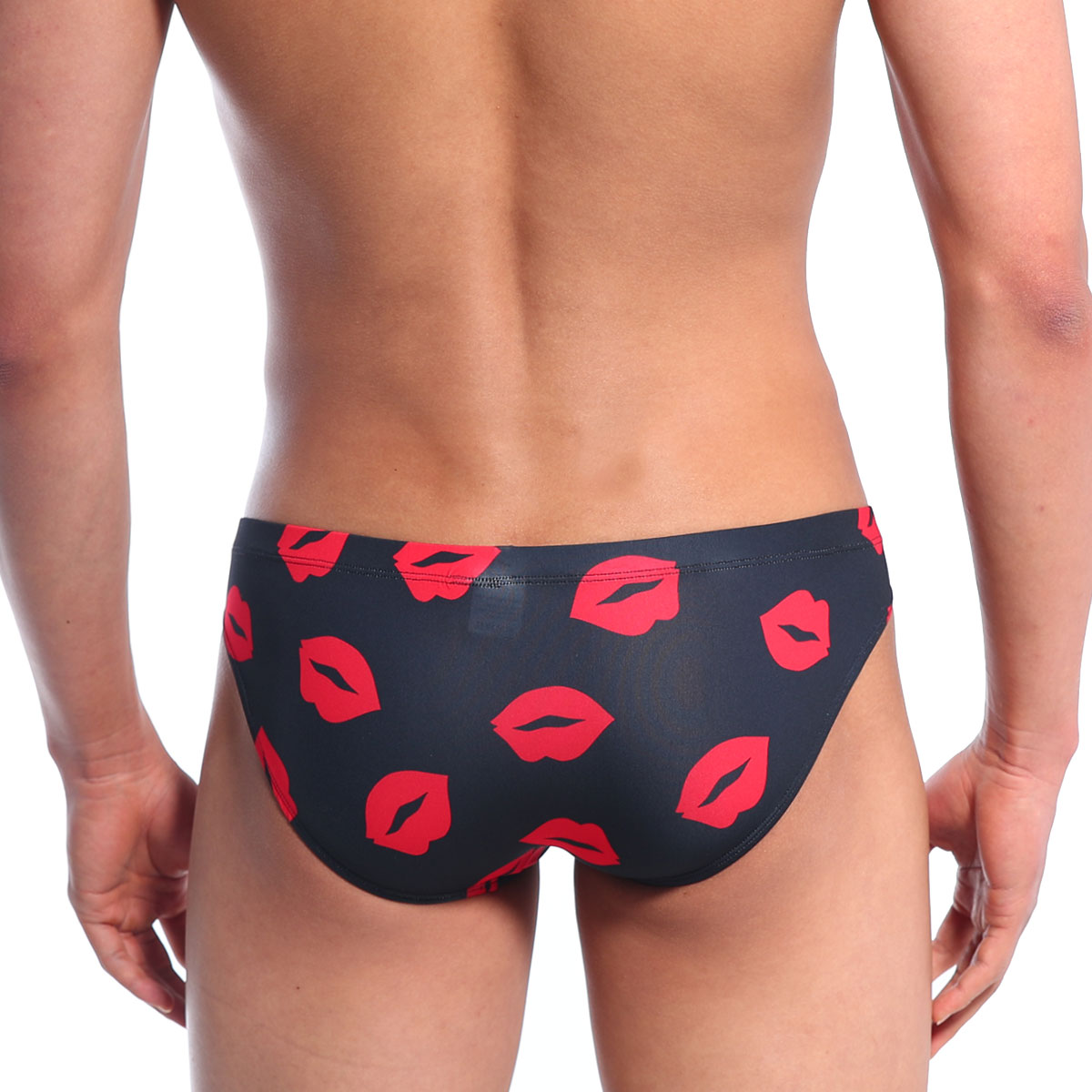 Black swim trunks by MetroMaleWear Vasco hip brief featuring bold red lipstick print pattern in kiss black color