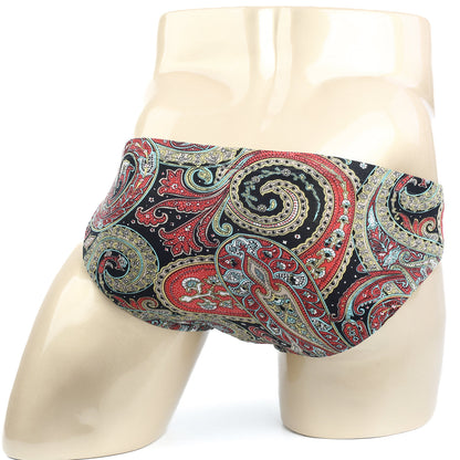 Vibrant red gold and teal paisley pattern men’s briefs by MetroMaleWear displayed on a mannequin
