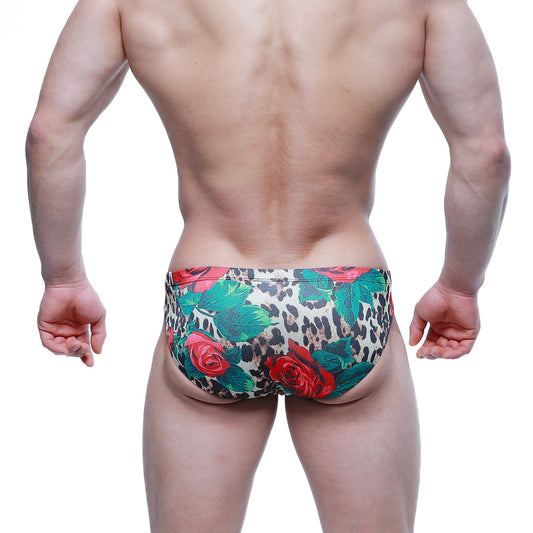MetroMaleWear Rosee Bikini 5103-M81 leopard print swim trunks with vibrant red roses and lush green leaves design