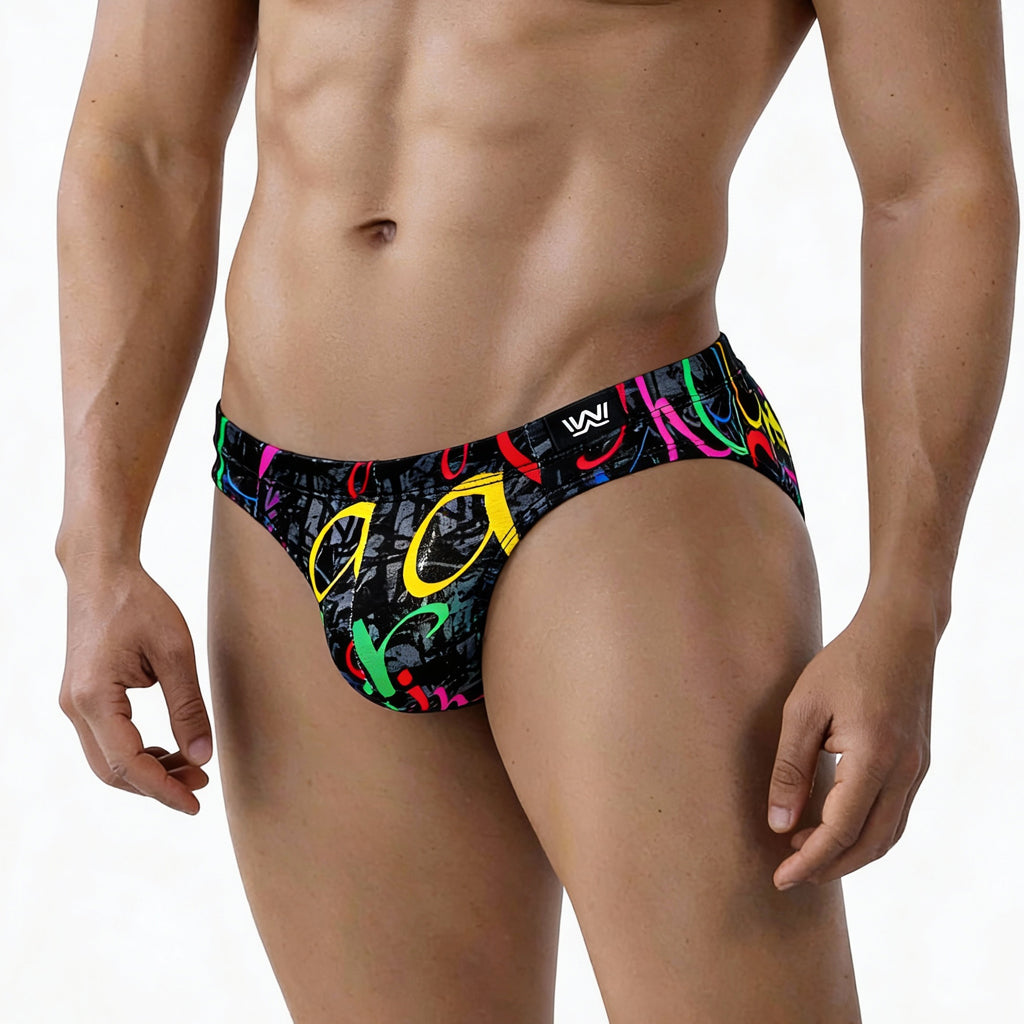 Black swim trunks by metromalewear with neon pink yellow green and red graffiti style graphic vibrant colors