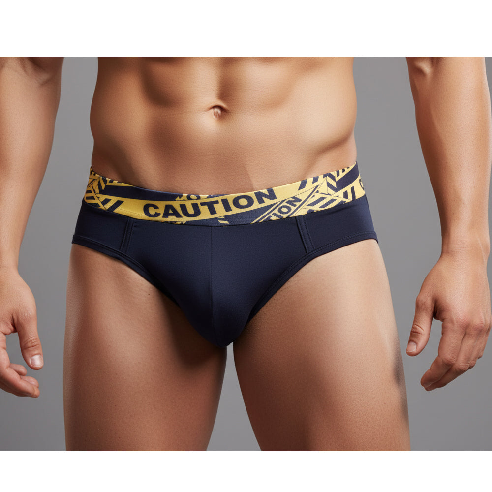 Navy blue MetroMaleWear caution brief 5203-60 with yellow and black caution tape patterned waistband front side view