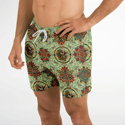 Men's swim shorts by Maris Equi in green with a colorful mosaic pattern featuring an elastic waistband and drawstring.