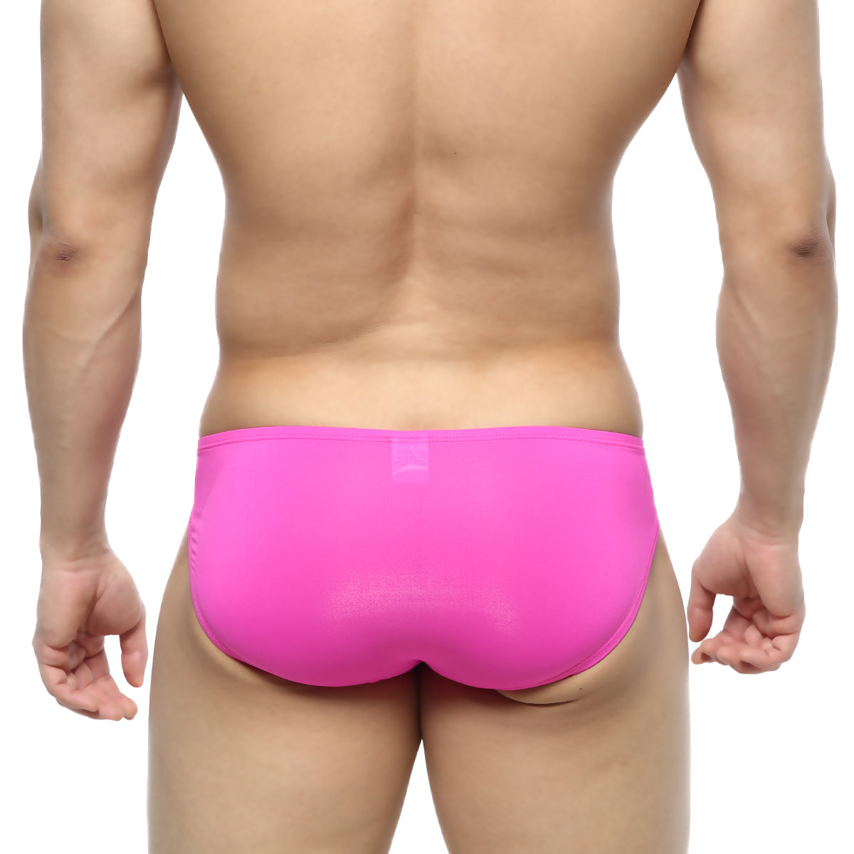 Bright pink form-fitting metroMalewear cesar bikini swim trunks made of smooth stretchy fabric
