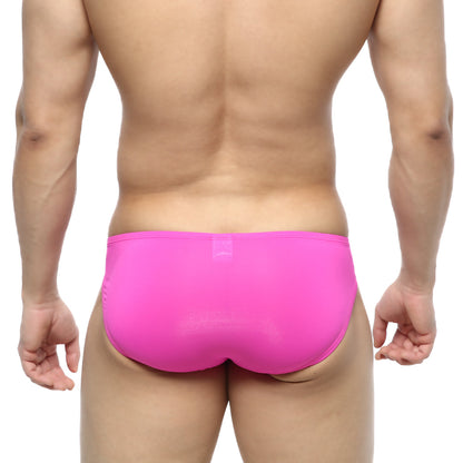 Bright pink form-fitting metroMalewear cesar bikini swim trunks made of smooth stretchy fabric