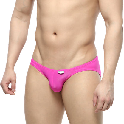 Bright pink form-fitting mens briefs with sleek smooth fabric and a white brand tag at the waistband metro malewear cesar bikini