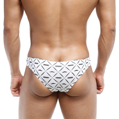 White swim trunks by nassim with bold black geometric mustache pattern from metroMalewear capri bikini caballero 6103-03