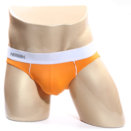 Orange metro male wear flow brief with white waistband and gray annoy branding in soft breathable fabric