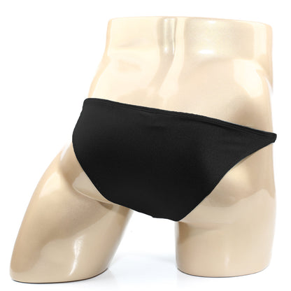 Black smooth-textured metroMalewear TROZO bikini briefs displayed on a mannequin showing front view
