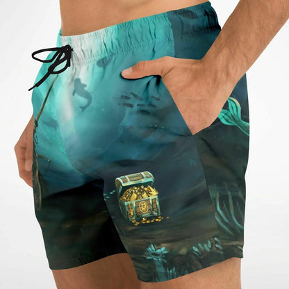 Men's swim shorts by Maris Equi featuring a treasure chest design in blue and black with side pockets and a drawstring waistband.