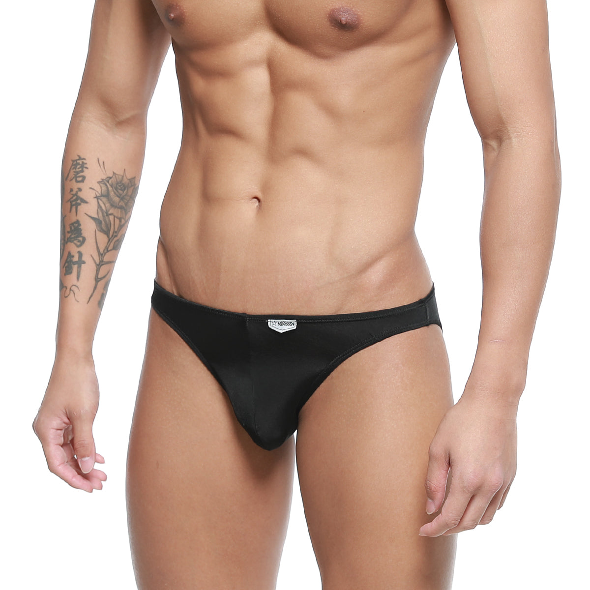 Black sleek form-fitting metro malewear fits bikini briefs with subtle brand tag on waistband