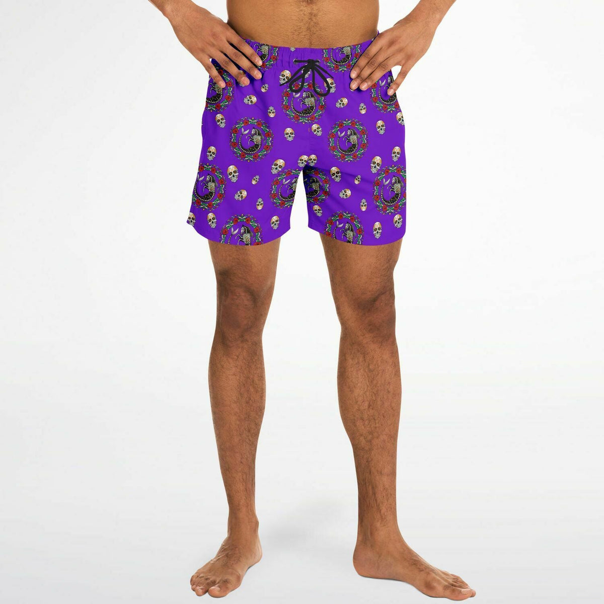 Men's swim shorts in vibrant purple with Day of the Dead skull pattern made by Maris Equi featuring an elastic waistband and drawstring.