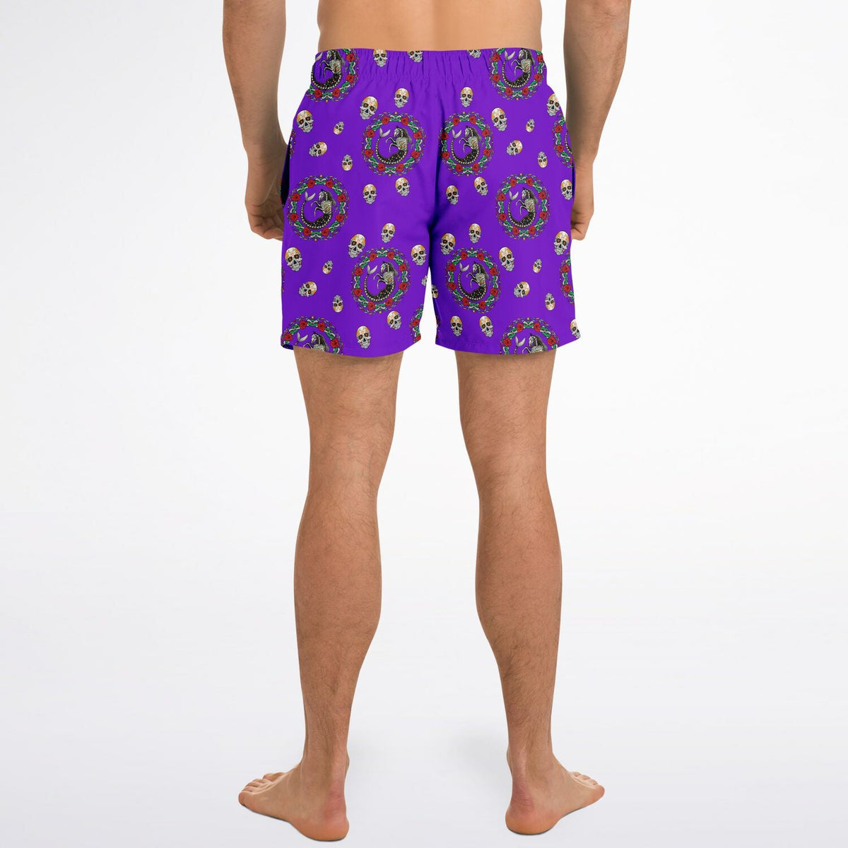 Men's purple swim shorts with Day of the Dead skull pattern made by Maris Equi featuring an elastic waistband.