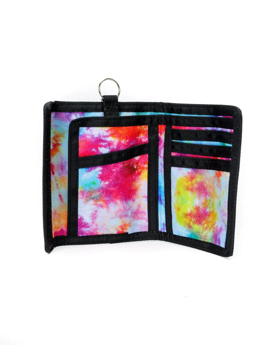 A vibrant tie-dye 80s velcro wallet with black trim and metal ring at the top for secure closure and easy carrying