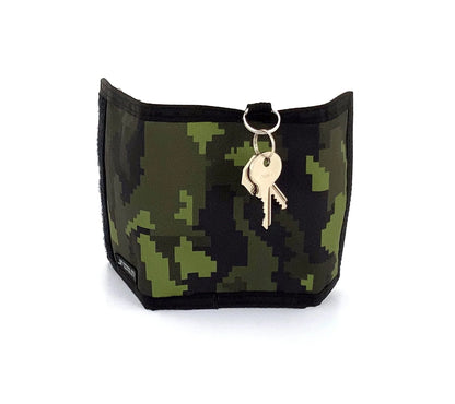 A compact 80s velcro wallet with green and black pixelated camouflage pattern and key ring attached at the top