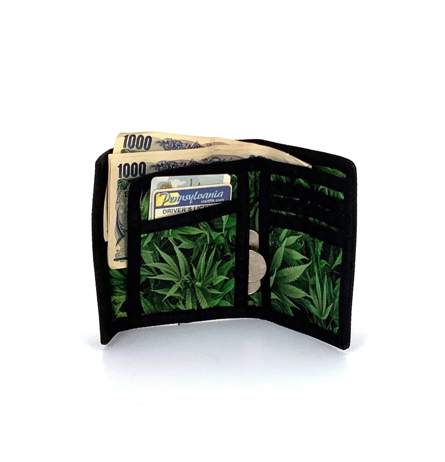 Black 80s veclro wallet with tri fold design and green cannabis leaf pattern on interior lining