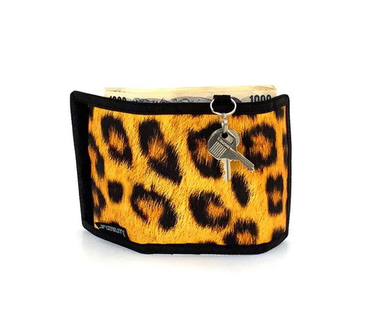 A vibrant yellow and black leopard print 80s velcro wallet with sleek black border and front keychain attachment