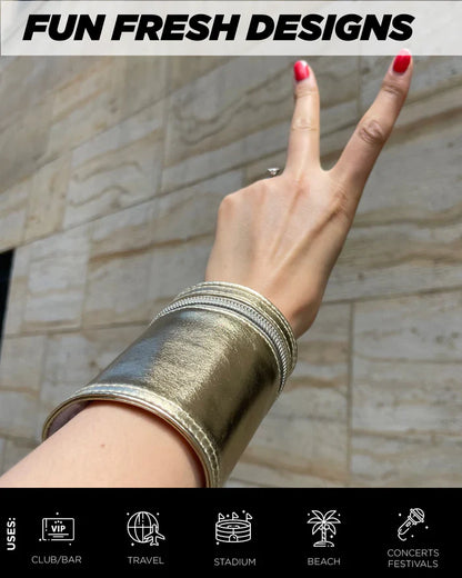A wide metallic gold cuff bracelet with textured surface and stitched edges from the 80s wrist wallet collection