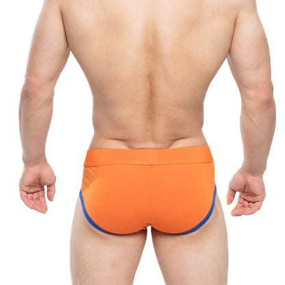 Bright orange MetroMaleWear Ciclerut Brief 9004-24 swim trunks with contrasting blue side trim for men