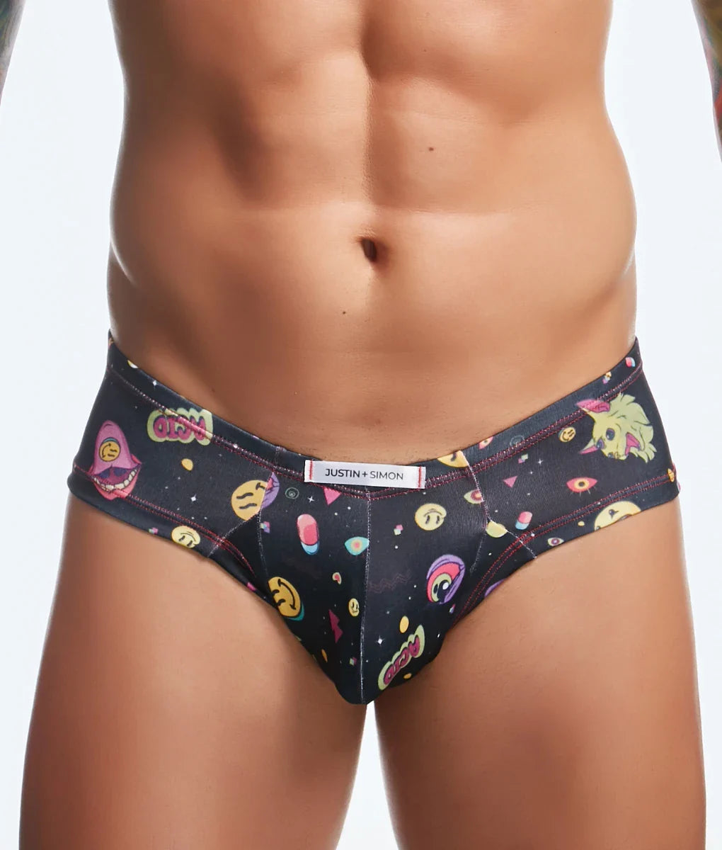 Black men’s briefs by Justin + Simon featuring vibrant cartoonish space-themed pattern with colorful emojis and cosmic elements