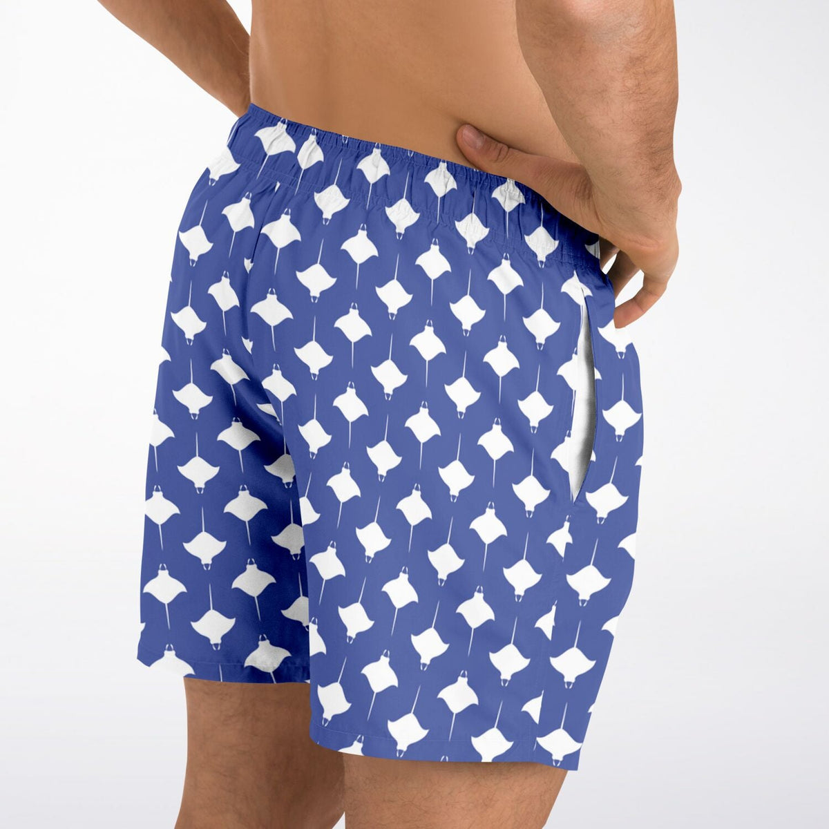 Men's swim shorts in blue with white manta ray pattern featuring an elastic waistband and side pockets by Maris Equi.