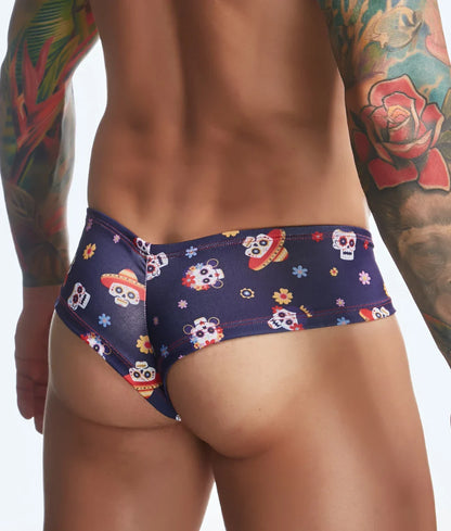 Dark blue swim trunks by justin + simon featuring vibrant sugar skull and floral patterns for fun prints