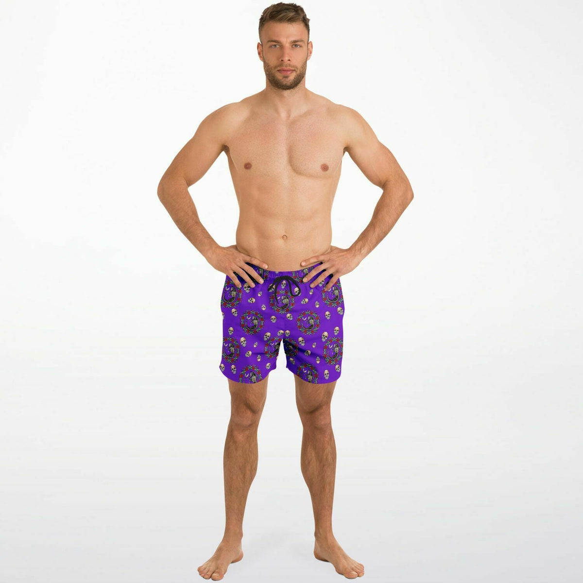 Men's purple swim shorts with Day of the Dead print featuring a drawstring waist by Maris Equi.