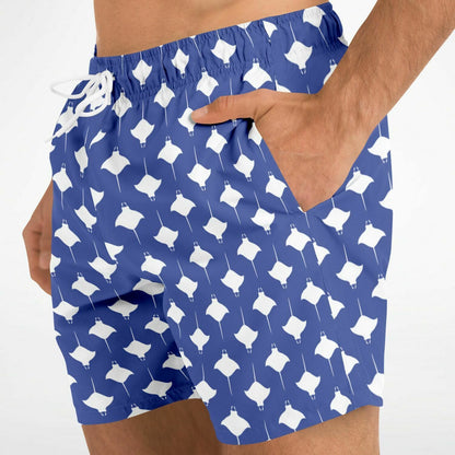 Men's swim shorts in blue with white manta ray pattern featuring an elastic waistband and side pocket by Maris Equi