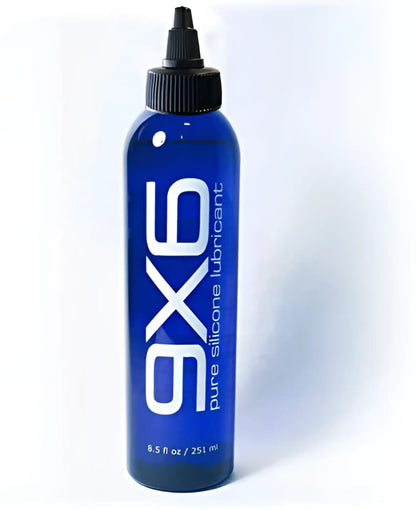 Blue glass bottle of 9x6 lube pure silicone lubricant with black cap and white label 8.5 fl oz 251 ml capacity