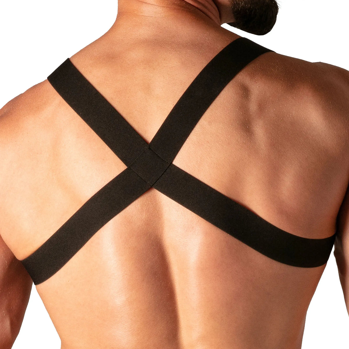 Black contour ring harness from Absolu Male By TOF Paris featuring a crisscross design on the back made from elastic material