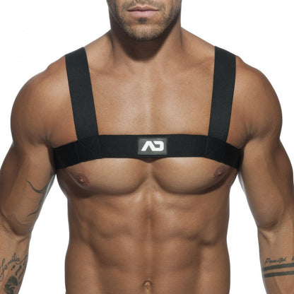 Black ad basic harness chest strap with adjustable shoulder straps and central logo patch showing front side