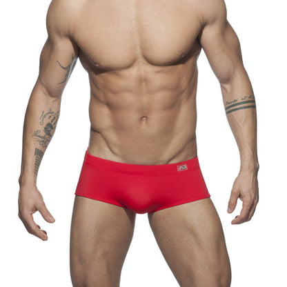 Red men’s ad basic sunga swim trunks with a snug fit and small logo on the waistband