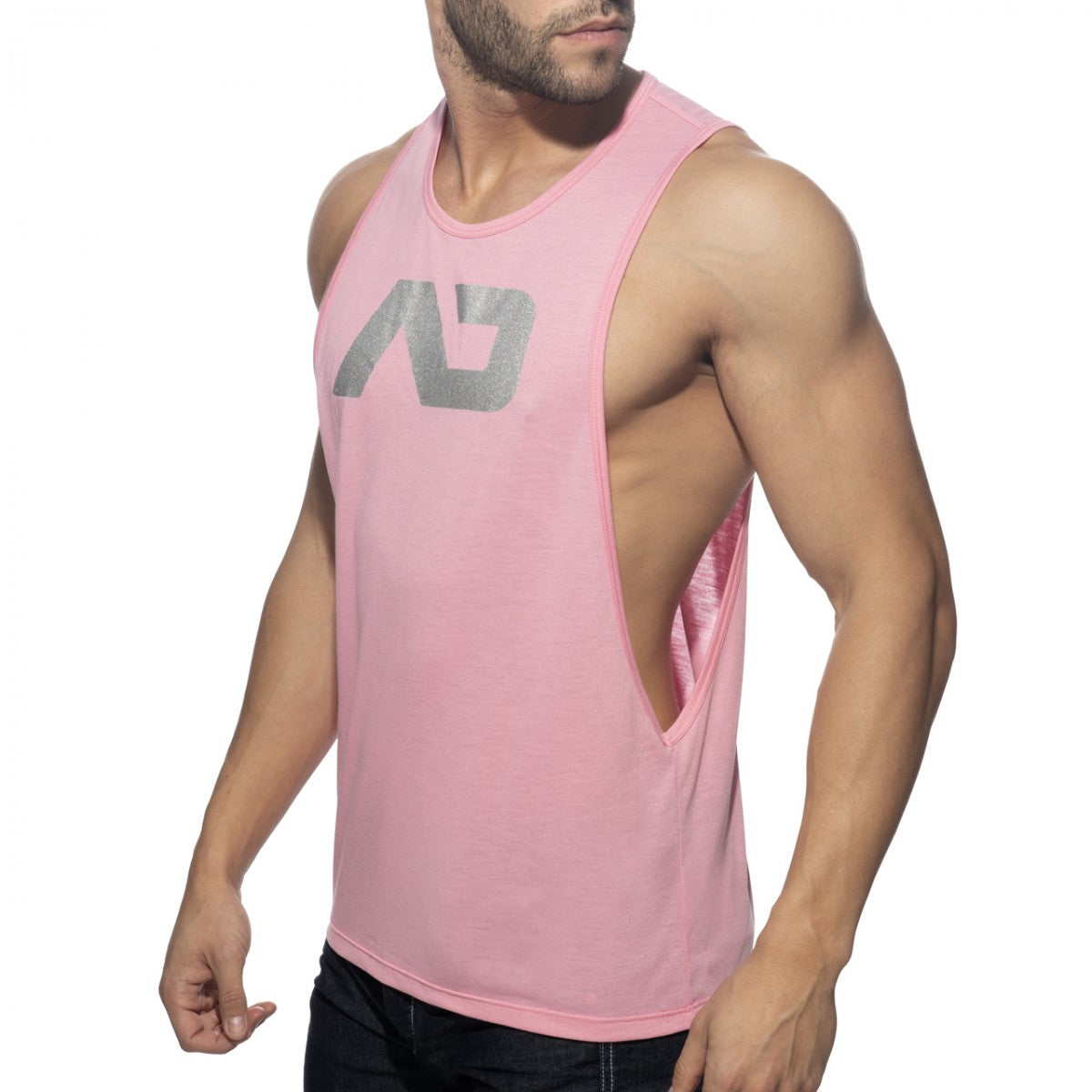 Pink sleeveless athletic tank top ad logo low rider with silver logo and side cutout for activewear use
