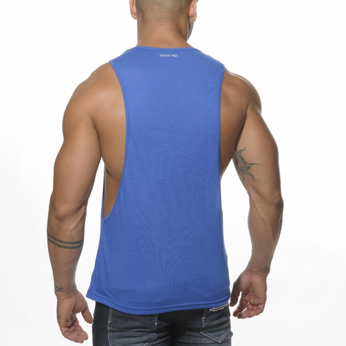 Blue sleeveless athletic tank top with back cutout and addicted branding at neckline for activewear use