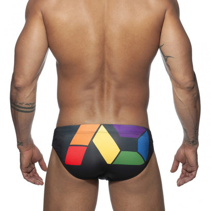 Black swim trunks ad pride bikini with bold geometric rainbow pattern in red orange yellow green blue and purple blocks
