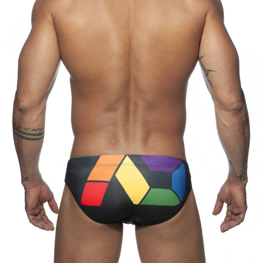 Black swim trunks ad pride bikini with bold geometric rainbow pattern in red orange yellow green blue and purple blocks