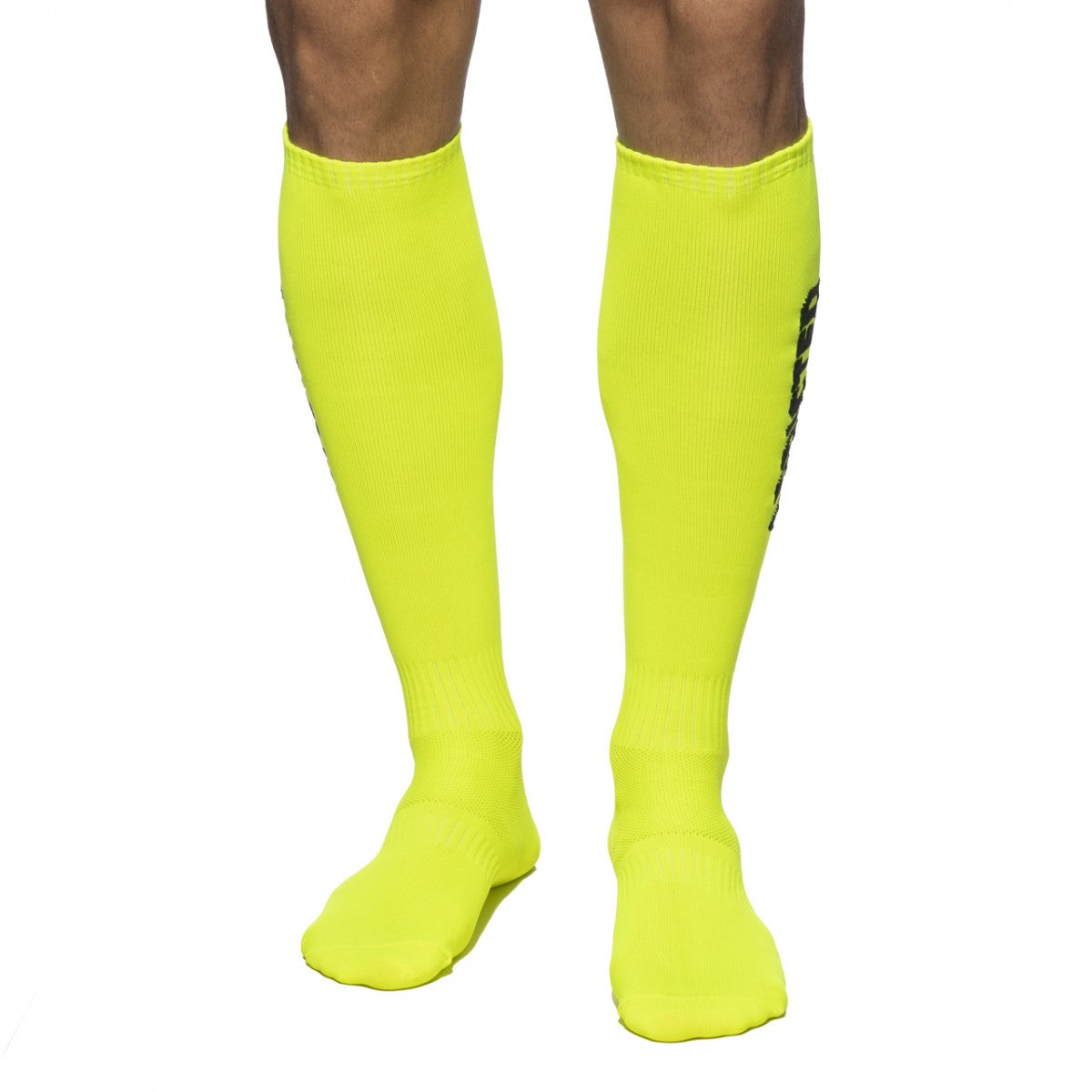 Addicted neon socks bright neon yellow knee-high athletic socks with ribbed texture and black vertical branding