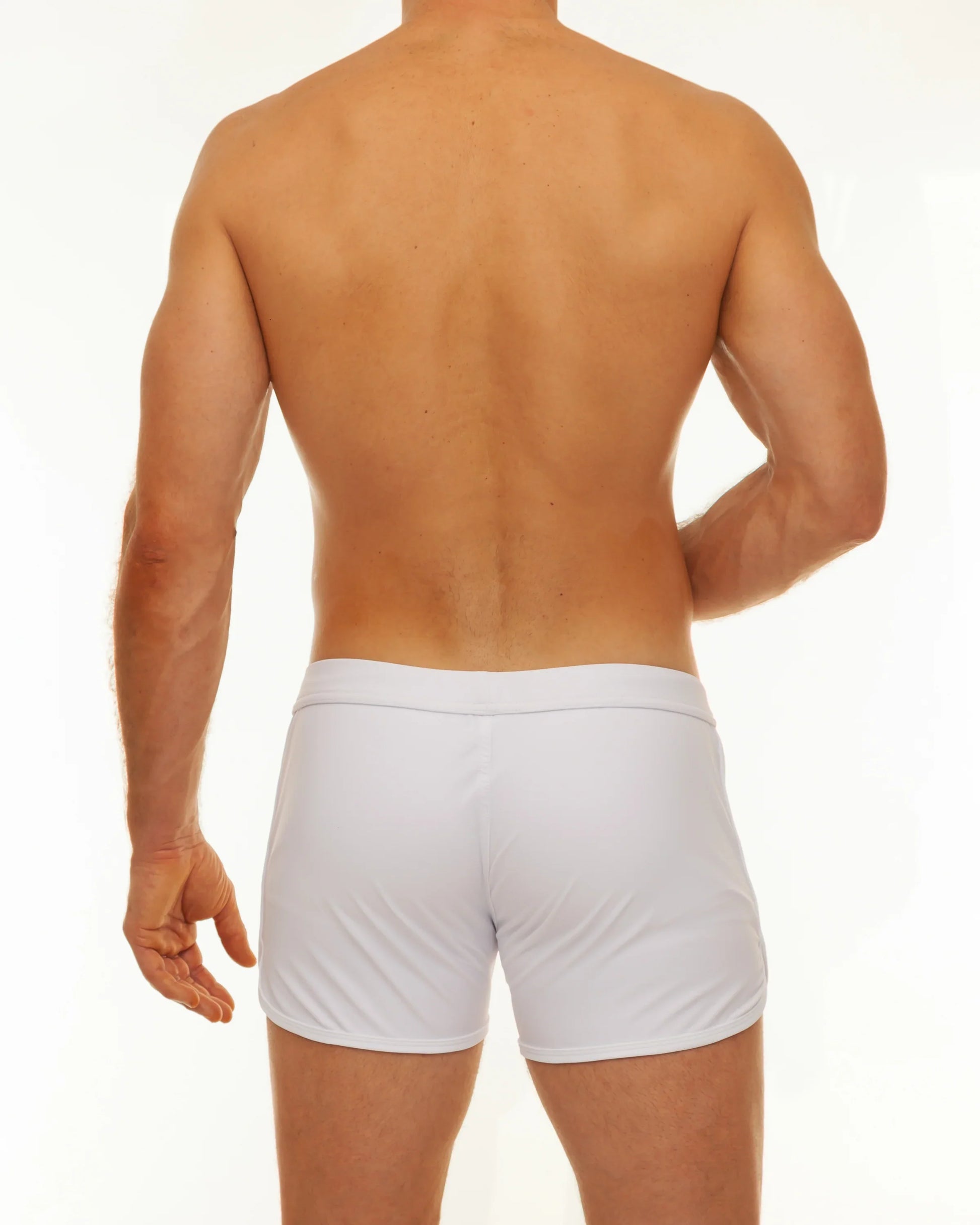 White athletic briefs with a smooth form fitting design featured in the along slit swim short collection
