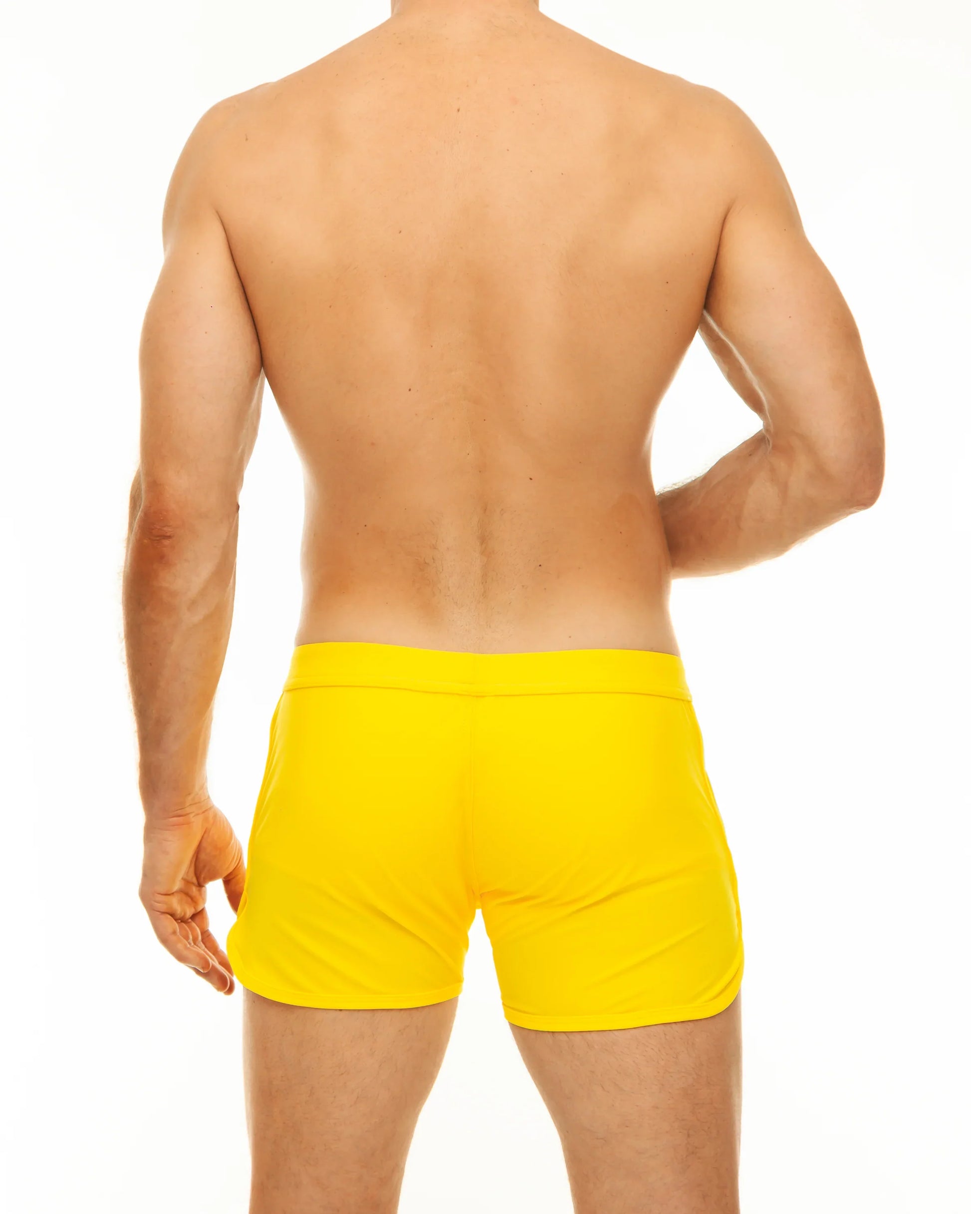Bright yellow along slit swim short swim trunks with a smooth fitted design perfect for swimming and beachwear