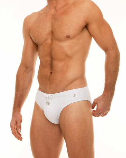 Along solid swim brief white swim trunks with drawstring waistband and small logo on the side