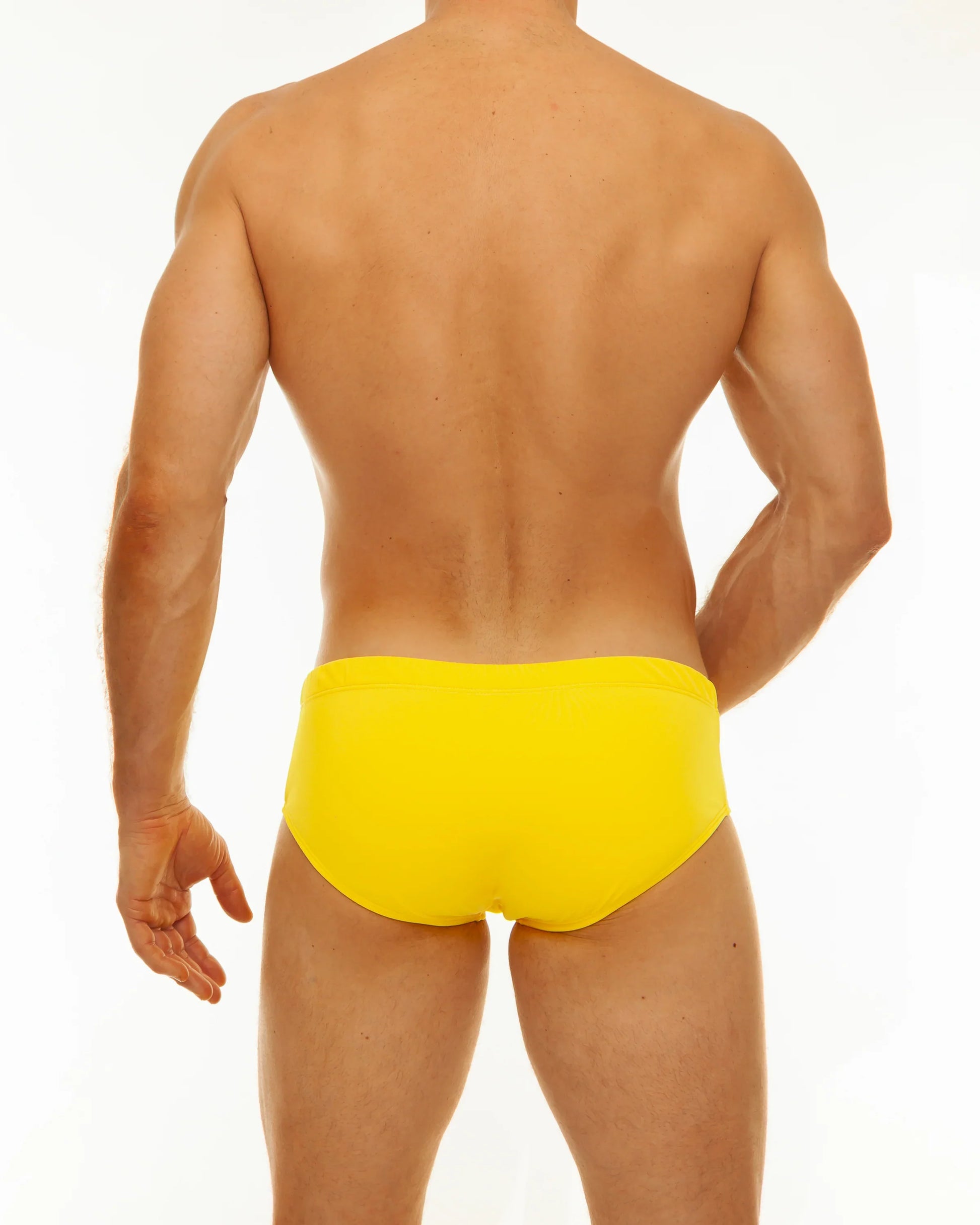 Bright yellow solid swim brief in a smooth fabric designed for comfortable swimming and beach use