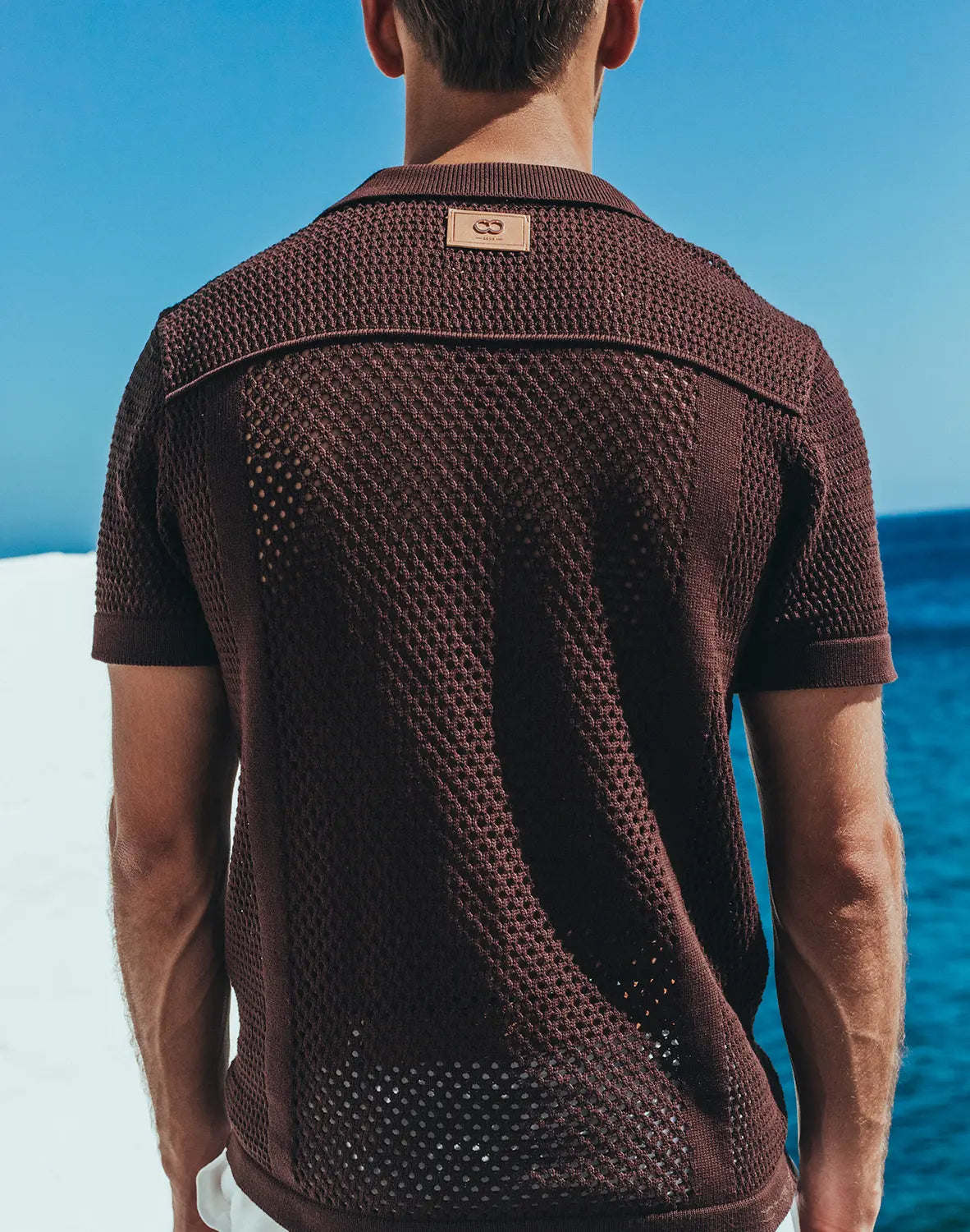 Amafi knit shirt brown textured knit polo shirt with subtle woven pattern and small leather brand tag at collar
