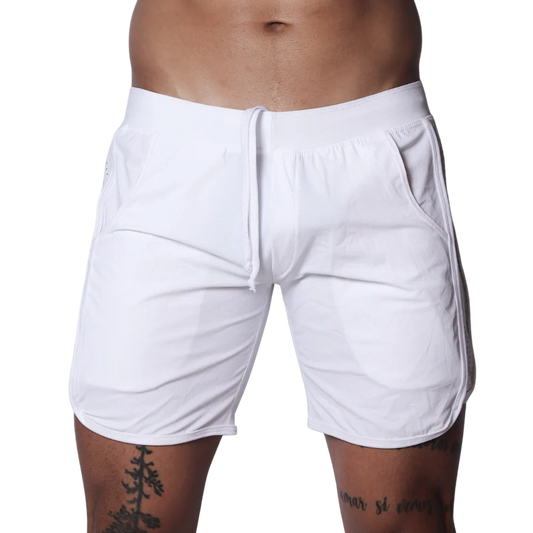White athletic shorts featuring an elastic waistband with drawstring, side pockets, and curved hem detail.