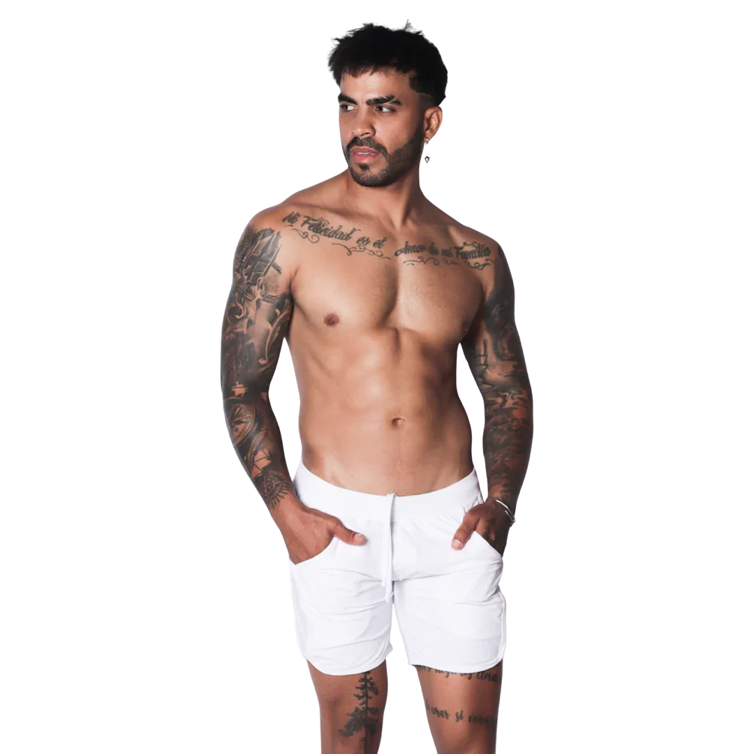 White athletic shorts featuring a drawstring waistband and side pockets on a tattooed model.