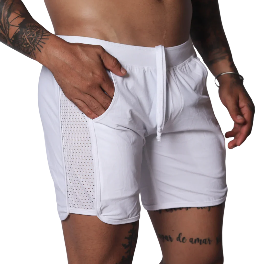 White athletic shorts with a drawstring waistband and side panels made of breathable mesh fabric.