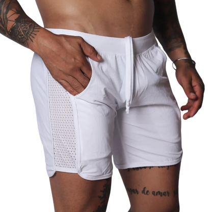 White athletic shorts with a drawstring waistband and side panels made of breathable mesh fabric.