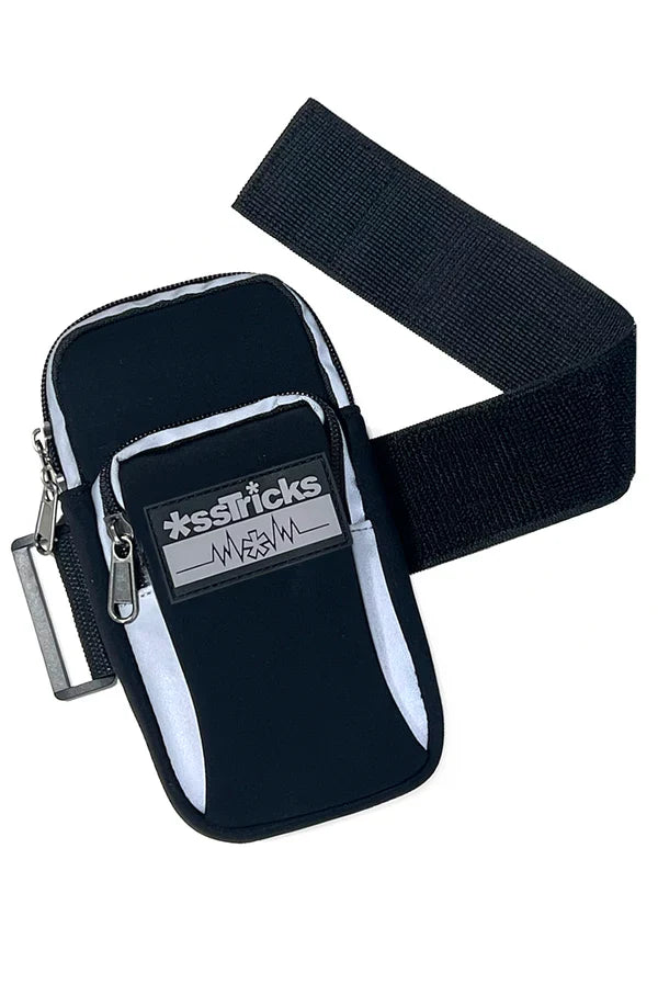 Black neoprene arm bag with silver zipper pulls white reflective stripes and xsstricks logo patch on front