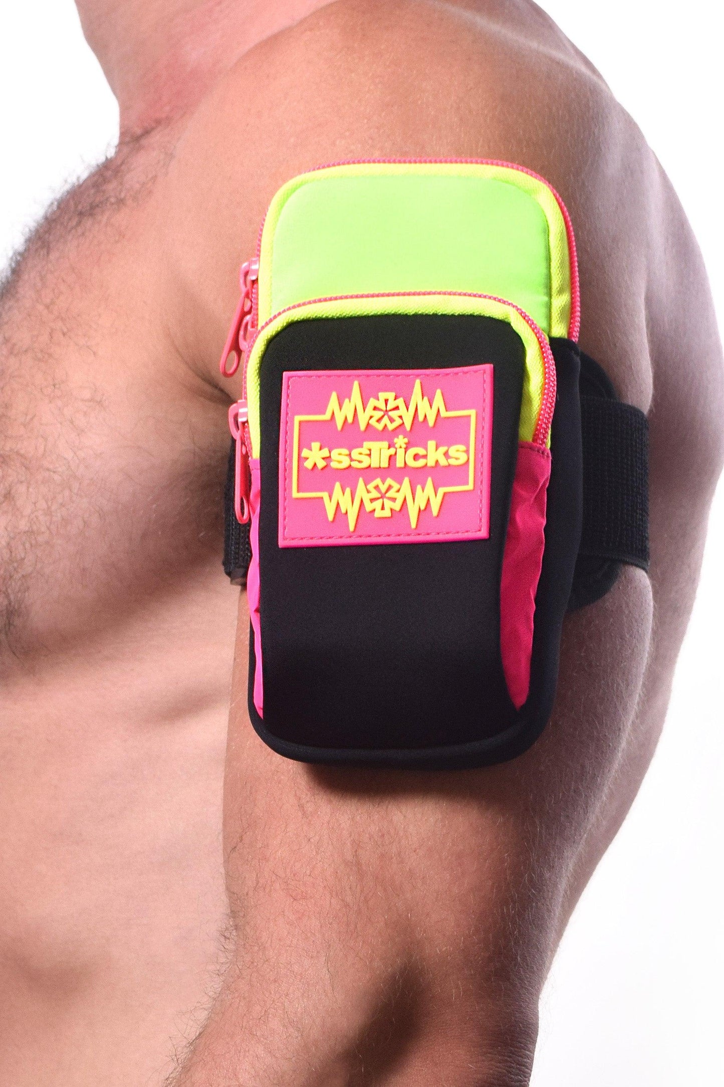 Neon green and black arm bag with pink zipper accents and bold sstricks logo patch for hands-free carrying